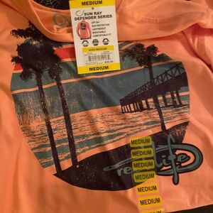 New medium reel life women’s peach color fishing shirt